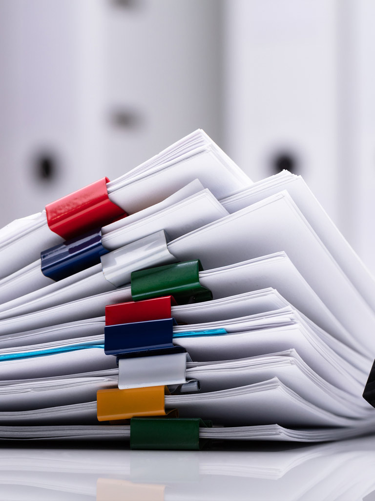 Stack of resource consent papers with coloured clips